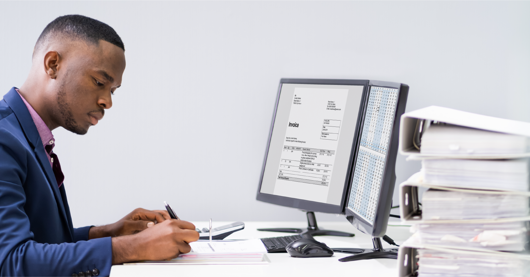 Photograph of an SDR working at a desk in front of two computer screens